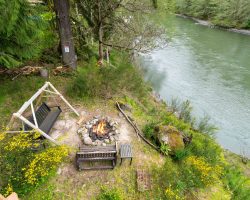 Fire pit next to water river cabin fire pit